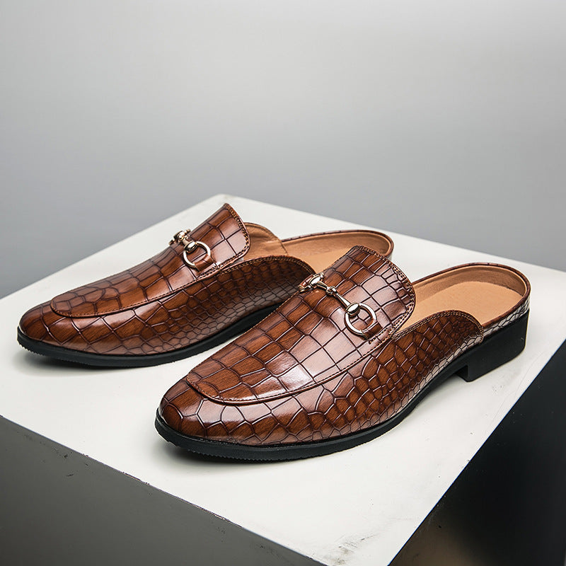 Brown genuine leather mule with croc-embossed finish, buckle strap, open back.