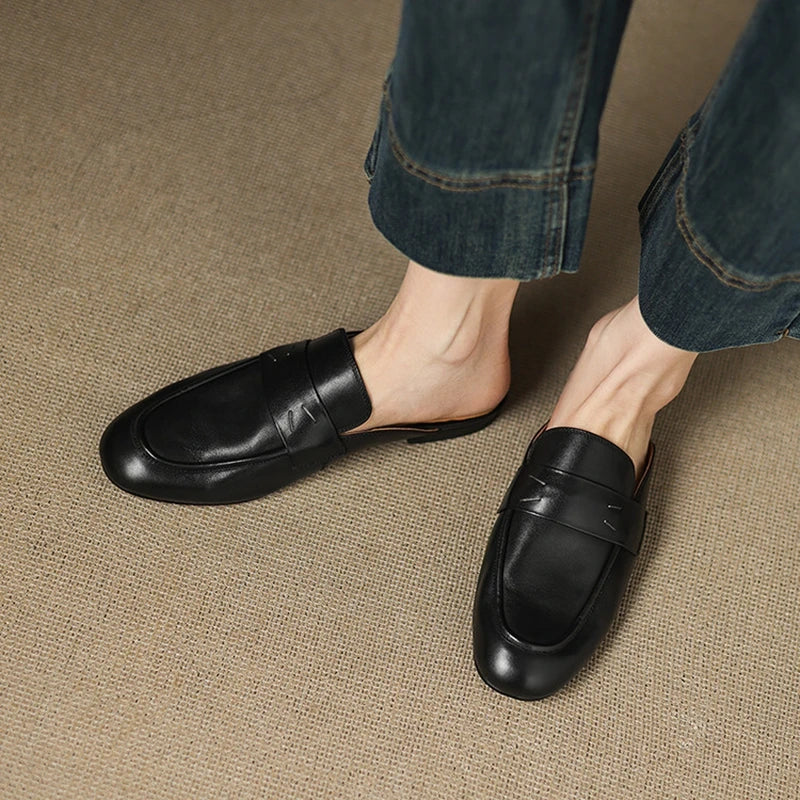 Black genuine leather mules with slip-on loafers and low-profile rounded toe