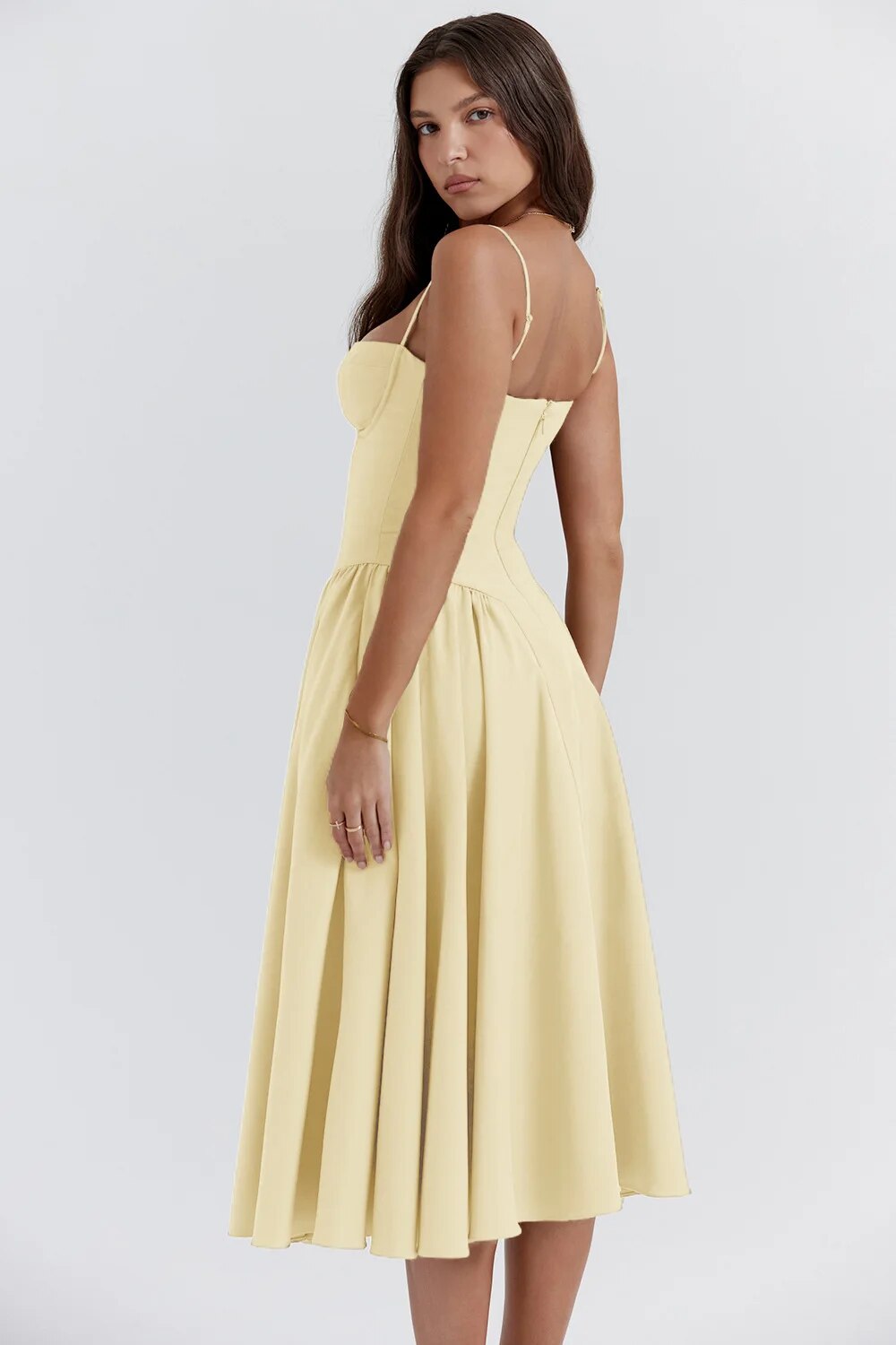 Yellow corset sundress with spaghetti straps and a pleated A-line midi skirt