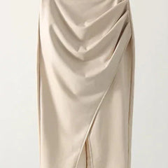 Cream leather midi skirt with draped front, diagonal seam, and front slit