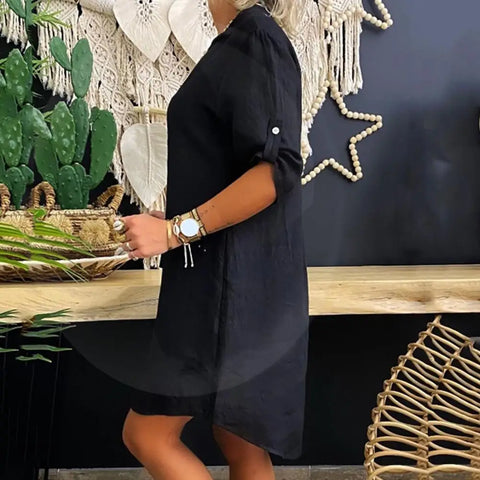 Black collared shirt dress with short sleeves, button front, loose A-line silhouette