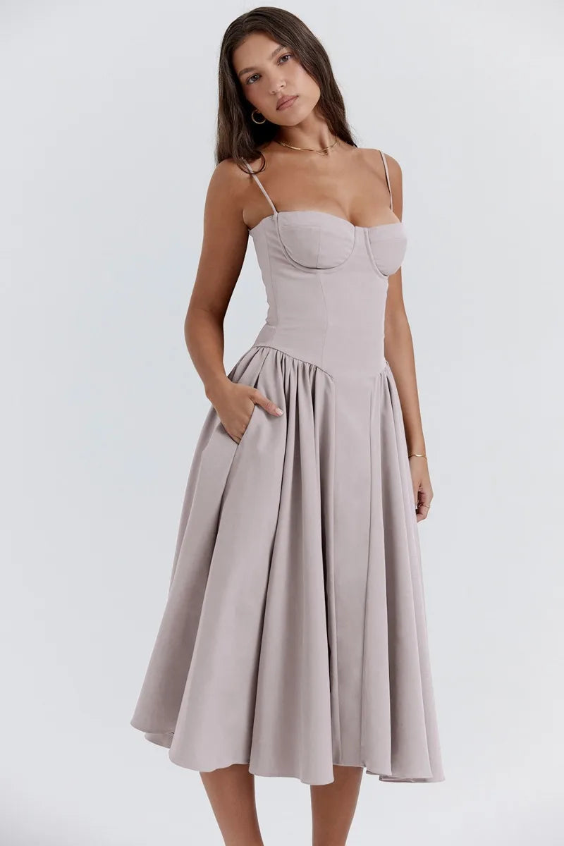 Light gray corset sundress with spaghetti straps and a pleated A-line midi skirt