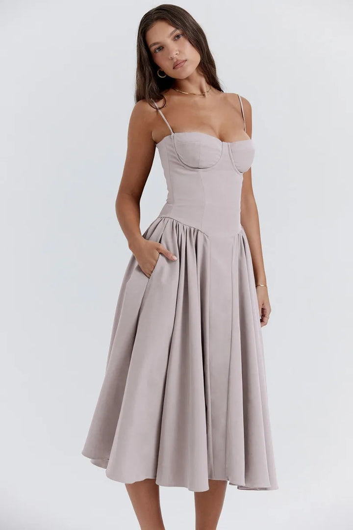 Light gray corset sundress with spaghetti straps and a pleated A-line midi skirt