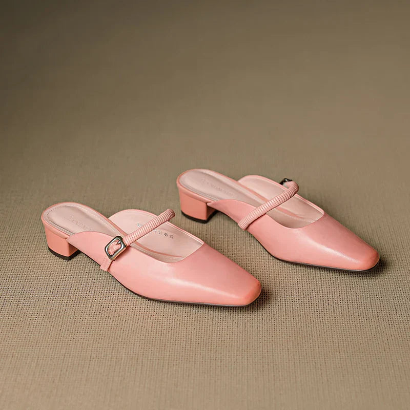 Pink Mary Jane mules shown side-by-side, elastic strap with square buckle and block heel