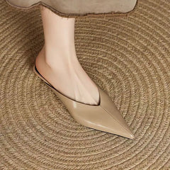 Beige leather mule with pointed toe and low profile, smooth slip-on design