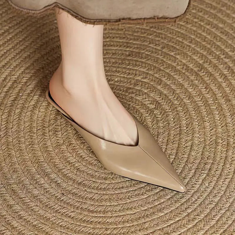 Beige leather mule with pointed toe and low profile, smooth slip-on design