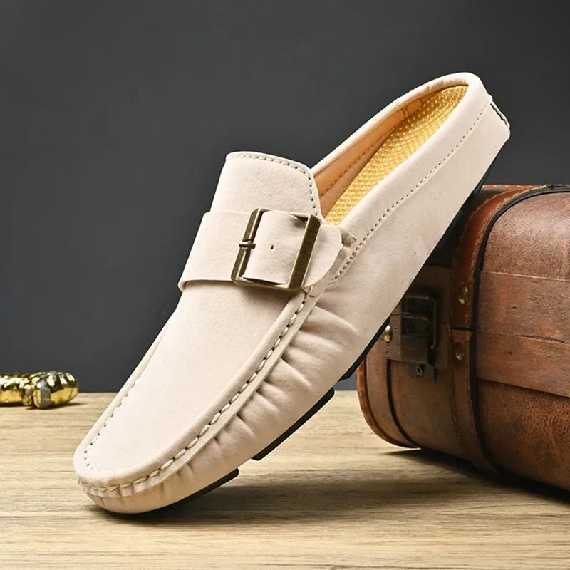 Cream suede mules with square buckle strap and stitched moc toe