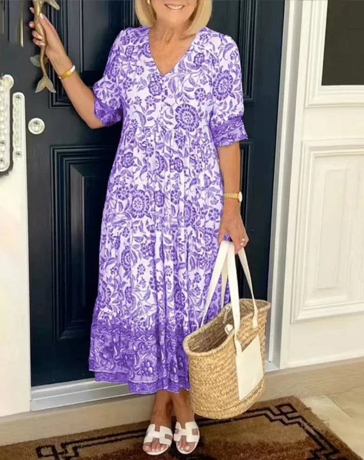 Purple floral V-neck dress with short sleeves and gathered tiered skirt