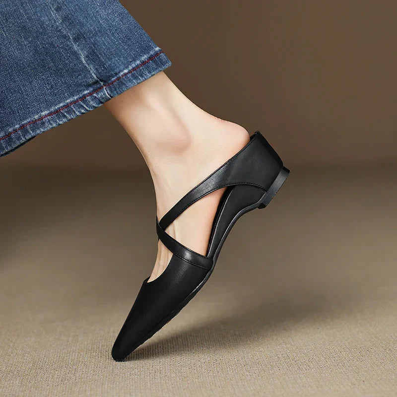 Black genuine leather mule with cross straps and pointed toe; low block heel