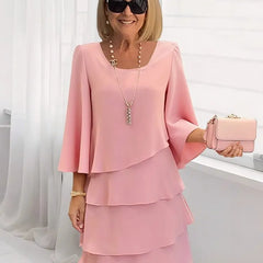 Blush pink ruffle tiered dress with flared sleeves and square neckline