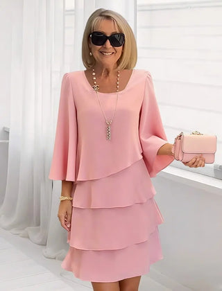 Blush pink ruffle tiered dress with flared sleeves and square neckline