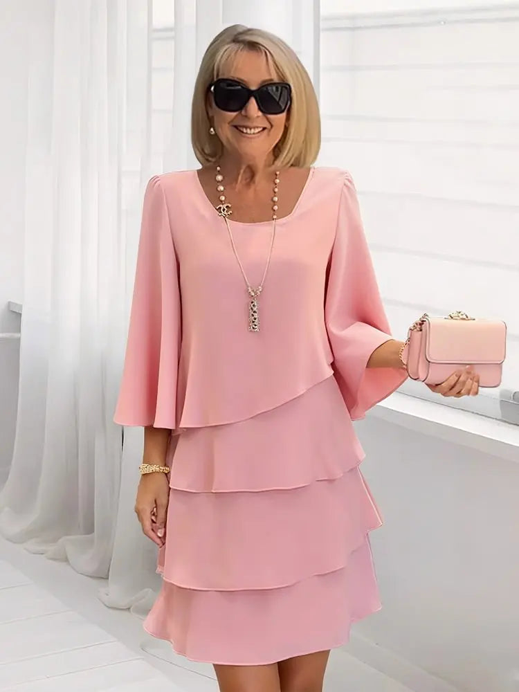 Blush pink ruffle tiered dress with flared sleeves and square neckline