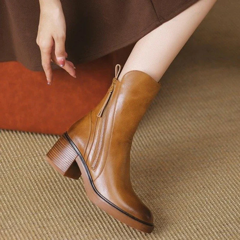 Brown ankle boots with side zipper, tassel detail, and mid block heel