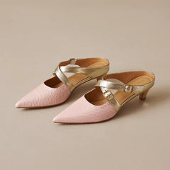 Pink textured leather mules with pointed toe, gold straps, and short block heels.