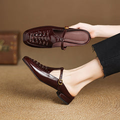 Brown leather mule with braided vamp and adjustable strap with round gold buckle