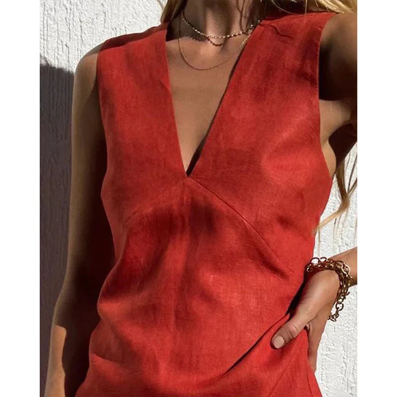 Red V-neck mini dress close-up, sleeveless with draped front