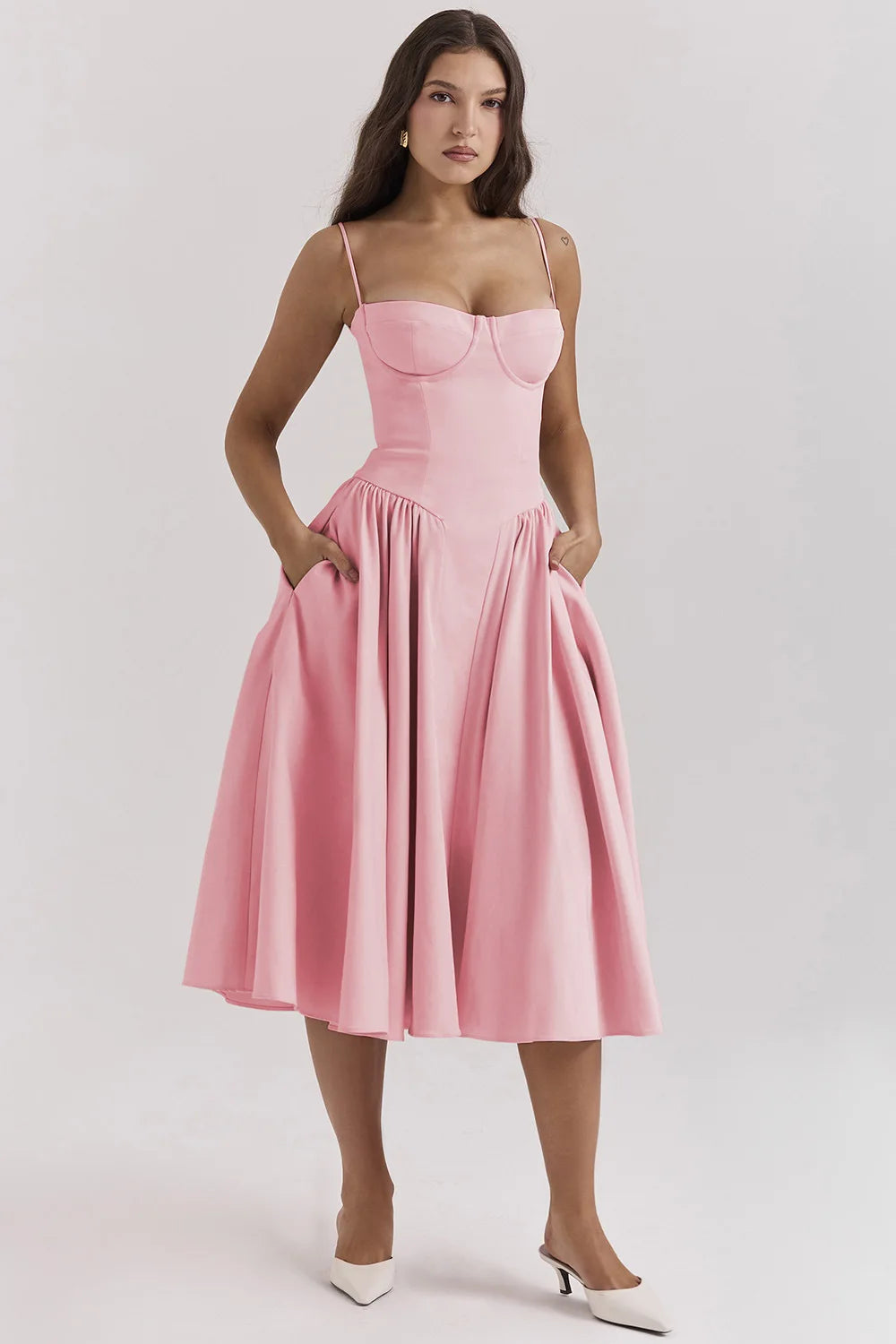 Blush pink corset sundress with spaghetti straps and flared midi skirt