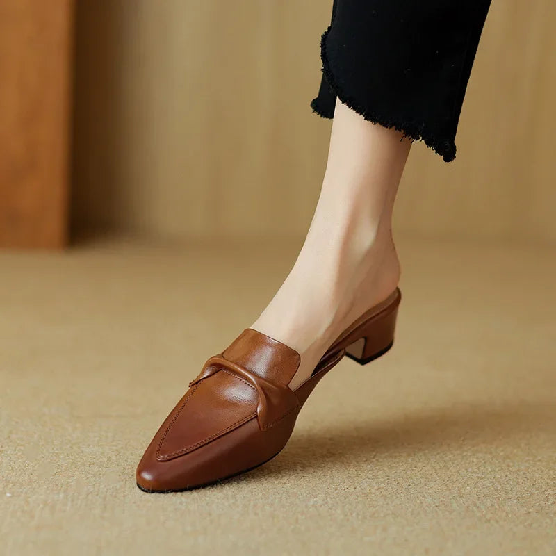 Brown genuine leather mule with low block heel and stitched slip-on loafer top