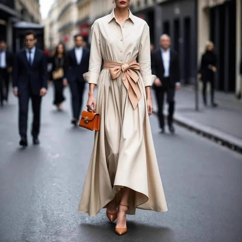Cream button-front maxi dress with shirt collar and tied waist, asymmetrical drape