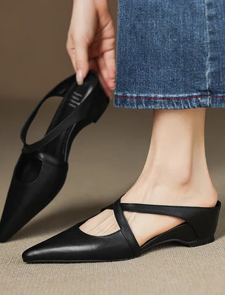 Black genuine leather mule with pointed toe, low block heel, and T-strap slingback