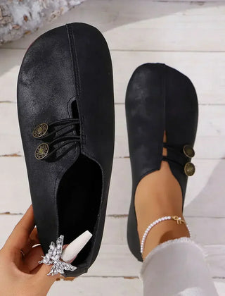 Women’s orthopedic suede loafers, black lace-up with decorative medallion detail