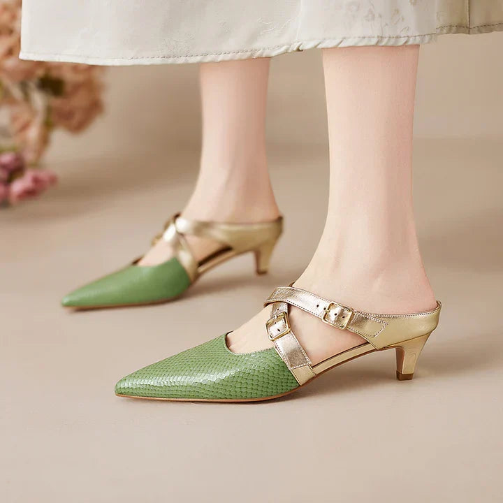 Green textured leather mules with pointed toe, gold ankle straps, and low heel