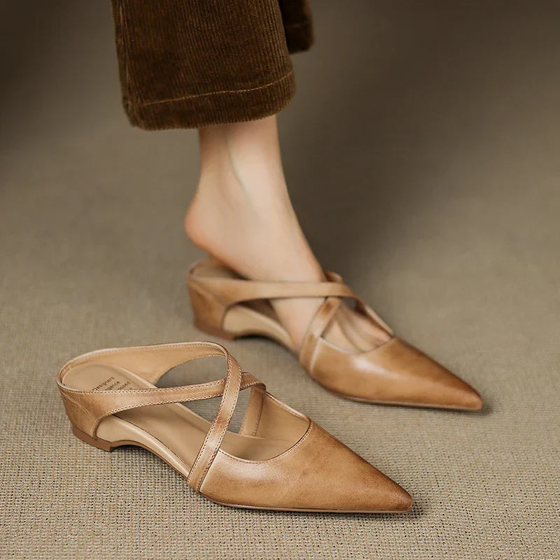 Tan leather mules pair, pointed toe with slingback straps and low block heel.