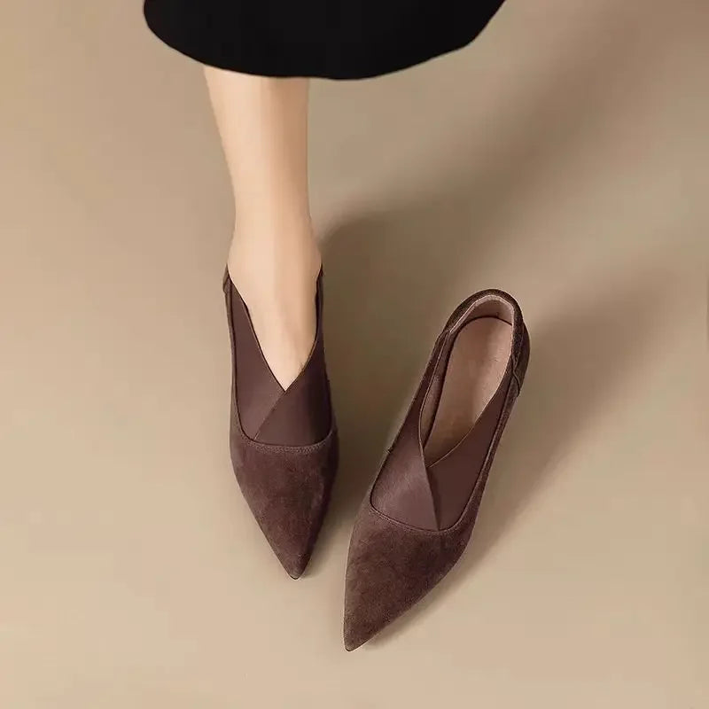 Brown suede pointed-toe heeled pumps with slim heel and slip-on shape