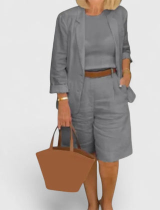 Gray 2-piece suit set with blazer jacket and shorts, paired with a brown waist belt