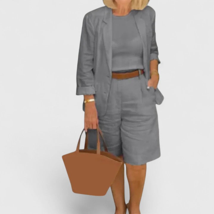 Gray 2-piece suit set with blazer jacket and shorts, paired with a brown waist belt