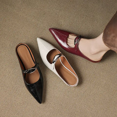 Leather mules set: black and maroon pointed-toe slip-ons with low block heels.