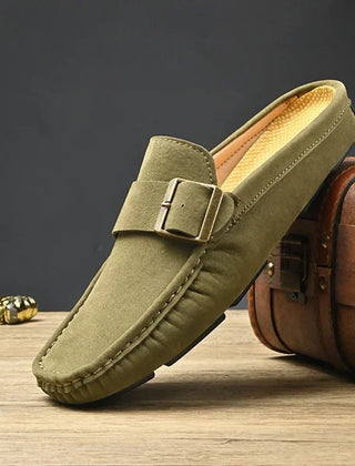 Green suede mules with square buckle strap and moc-toe stitching