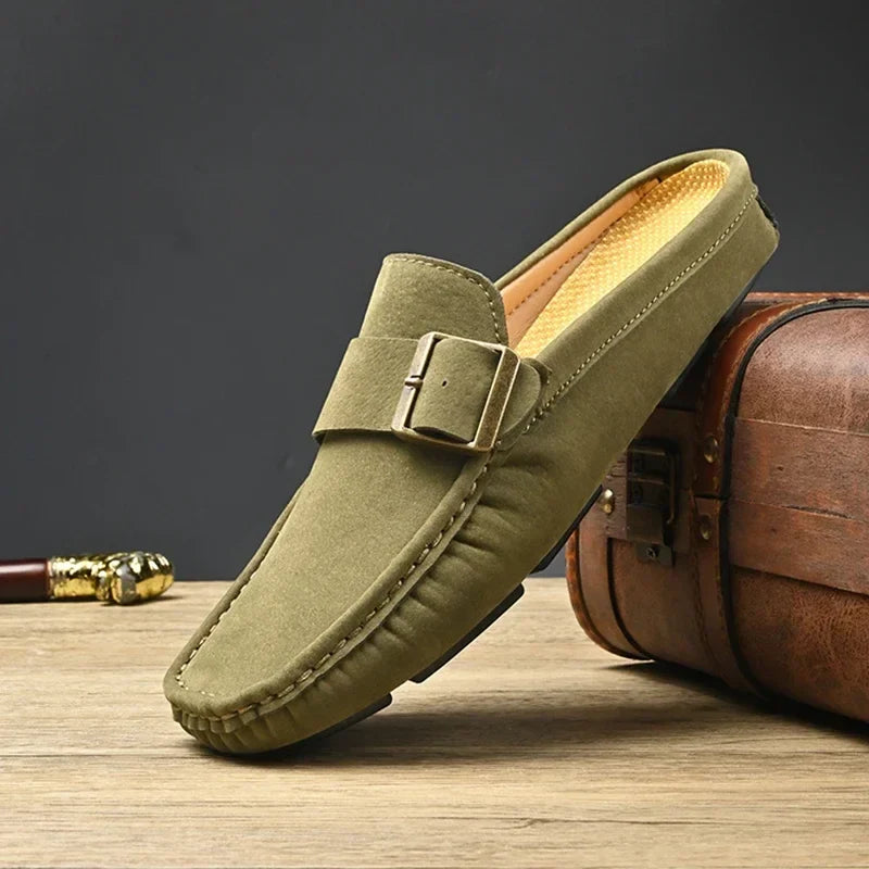 Green suede mules with square buckle strap and moc-toe stitching
