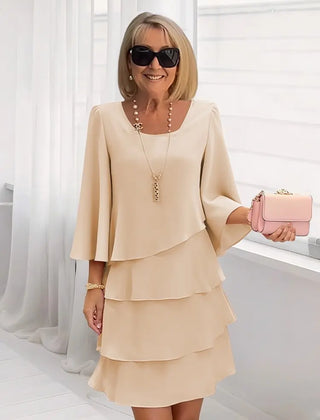 Cream pearl ruffle tiered dress with flared sleeves and square neckline