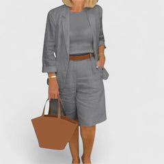 Gray 2-piece suit set with blazer jacket and shorts, featuring a brown waist belt