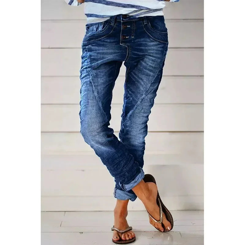 Stretch jeans in dark blue wash, five-pocket styling, slim tapered legs