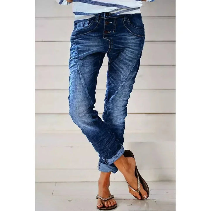 Stretch jeans in dark blue wash, five-pocket styling, slim tapered legs