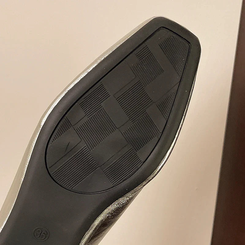 Lyra mules silver upper with black rubber sole tread