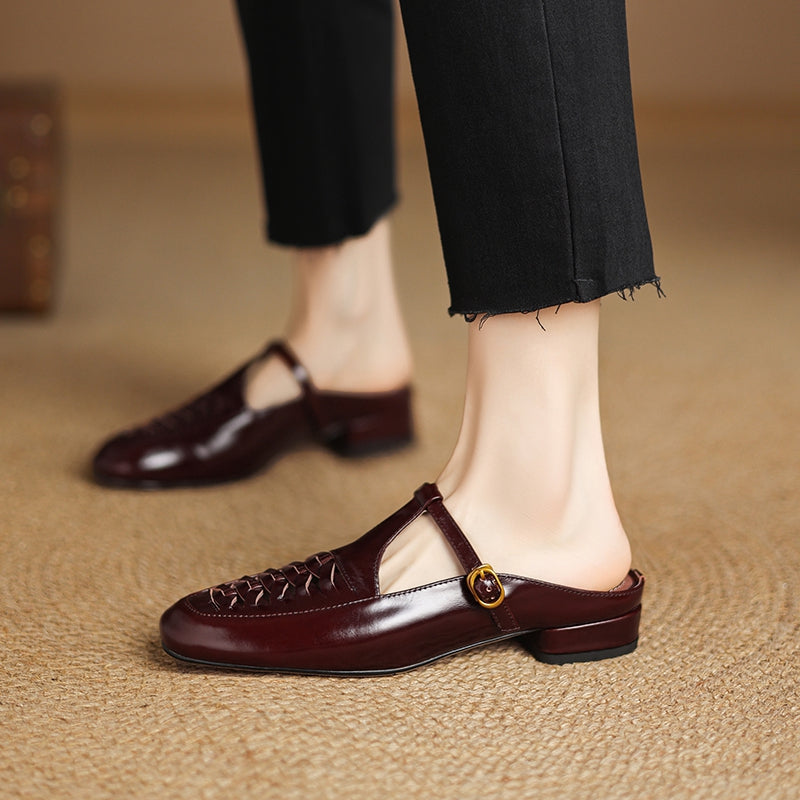 Brown leather mules with braided vamp and adjustable strap; low flat heel