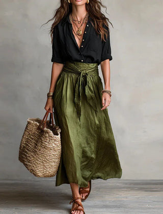 Two-tone maxi dress with black wrap-style bodice and dark olive gathered skirt