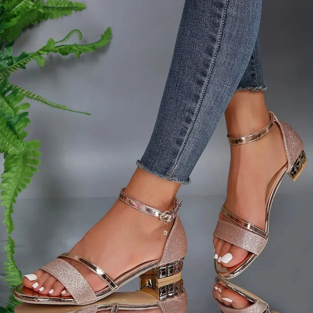 Elegant rose-gold glitter heeled sandals with thin metallic straps and buckle