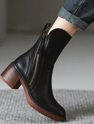 Black ankle boot with side zipper, tassel pull, and block heel