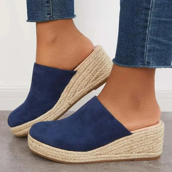 Blue slip-on wedge sandals with textured jute footbed and espadrille sole