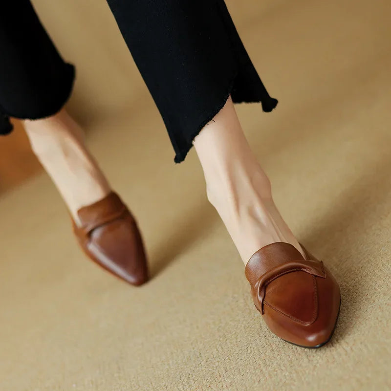 Beige genuine leather mules with low block heel and slip-on loafer design