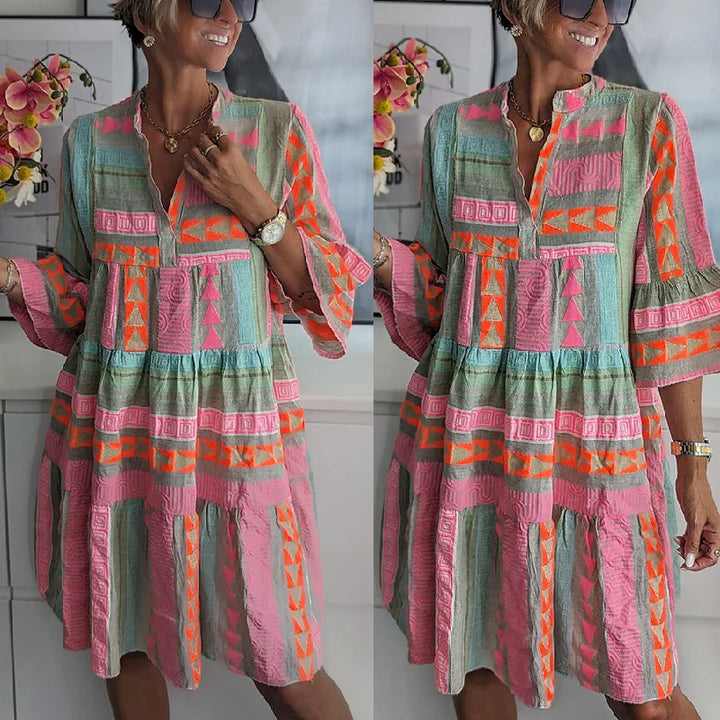 Boho spring dress full front view with tiered hem, teal base and bright geometric panels