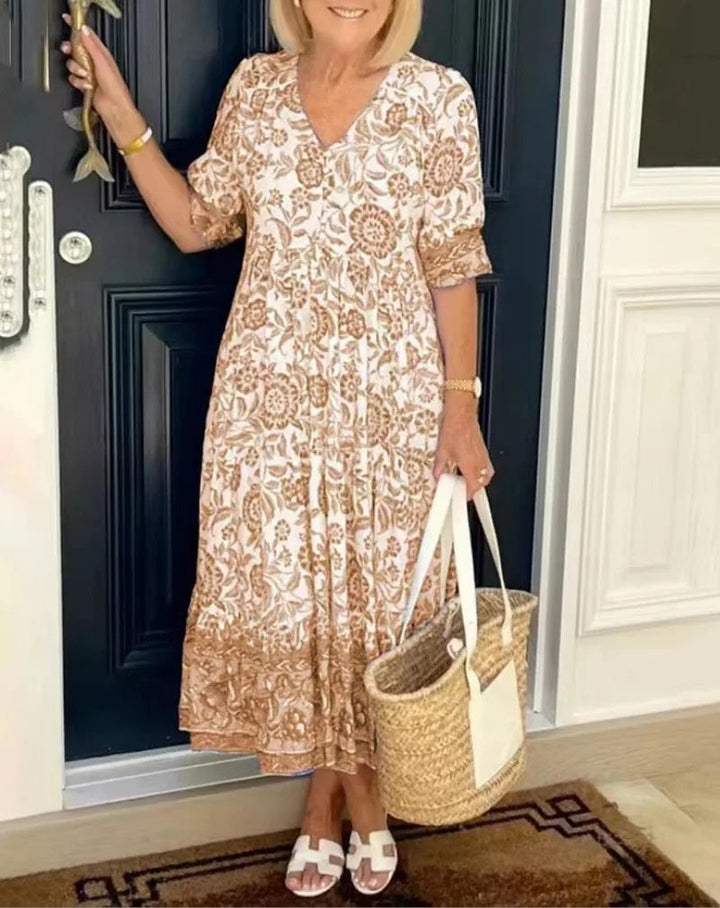 Beige floral V-neck dress with short sleeves and gathered tiered skirt