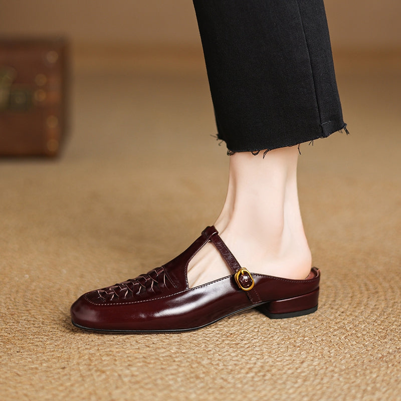 Brown leather mule with braided strap detail and round gold buckle on ankle