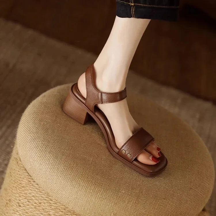 Brown leather slide sandals with ankle strap and chunky block heel