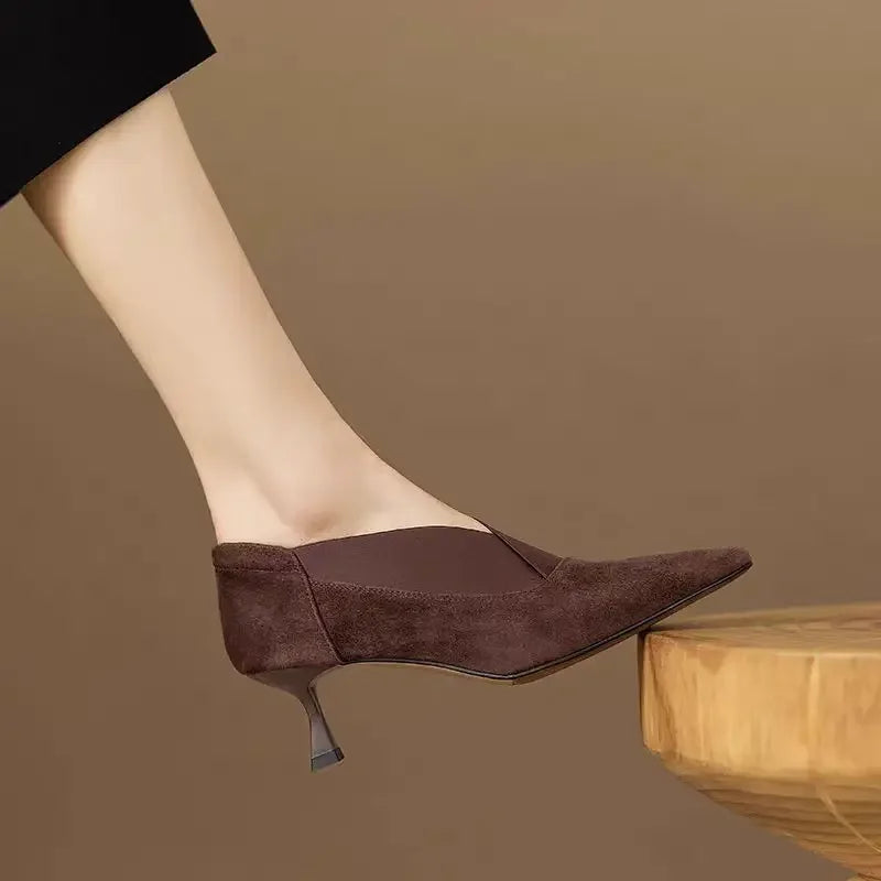 Brown suede pointed-toe heeled pumps with slim heel and top seam detail