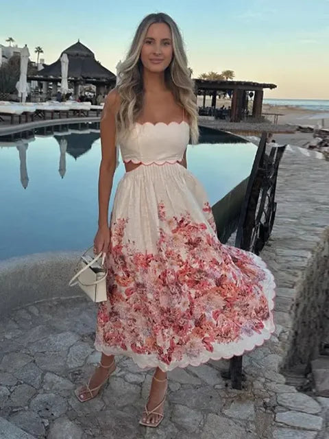 White sweetheart halter dress with red floral midi skirt and scalloped hem